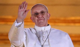 The newly elected Pope Francis I waves to the crowds from St Peter